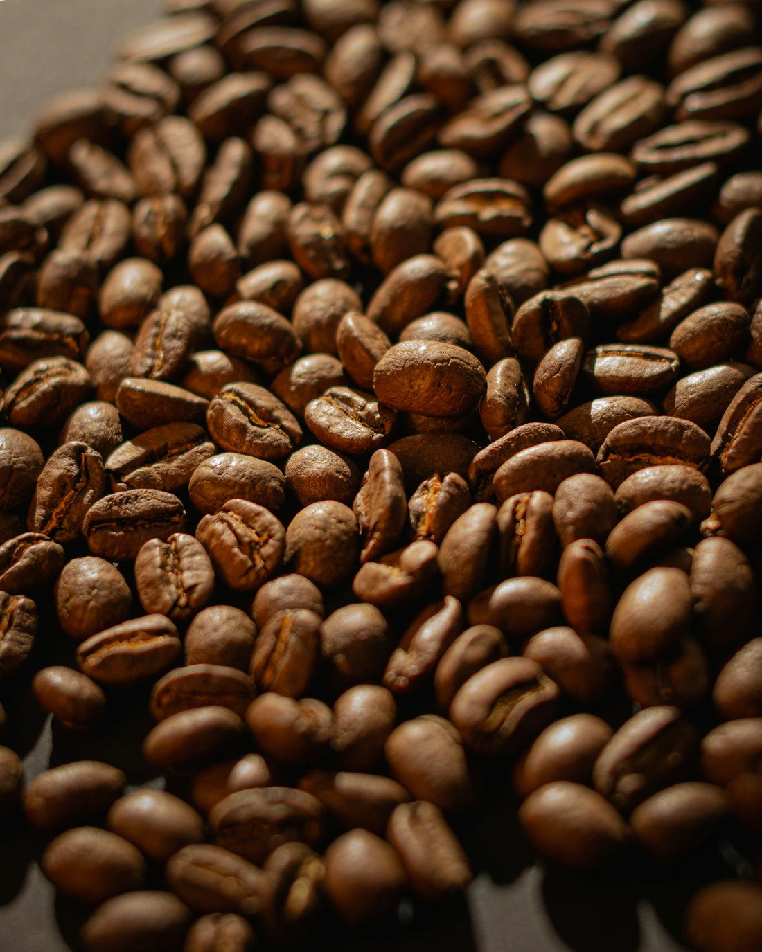 coffee beans on black surface
