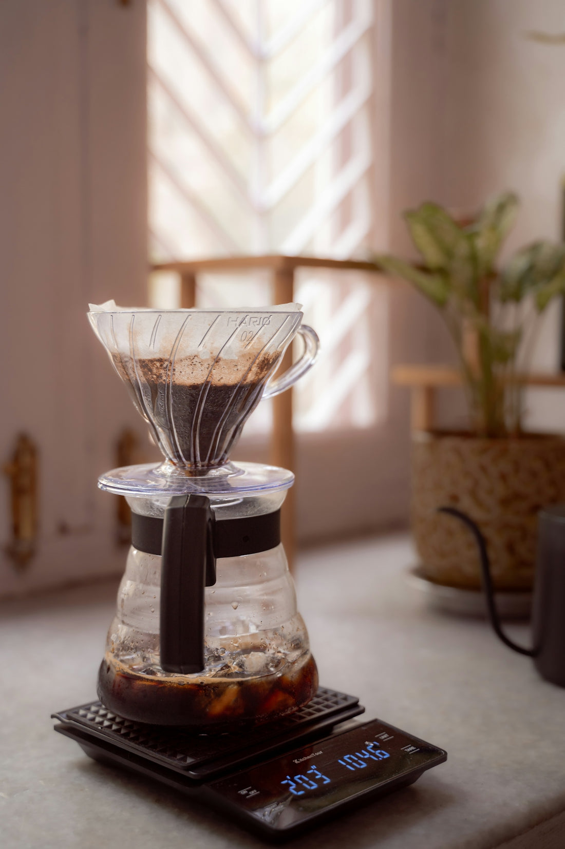 a coffee maker sitting on top of a scale