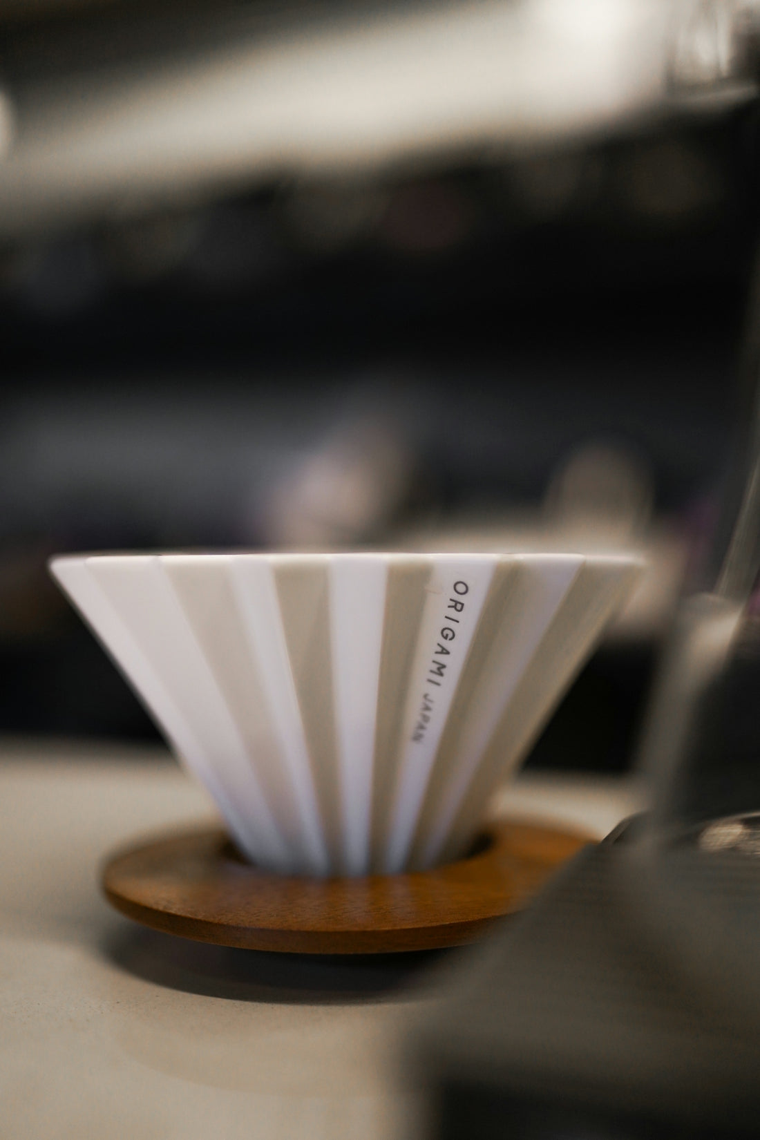 A coffee cup sitting on top of a wooden stand