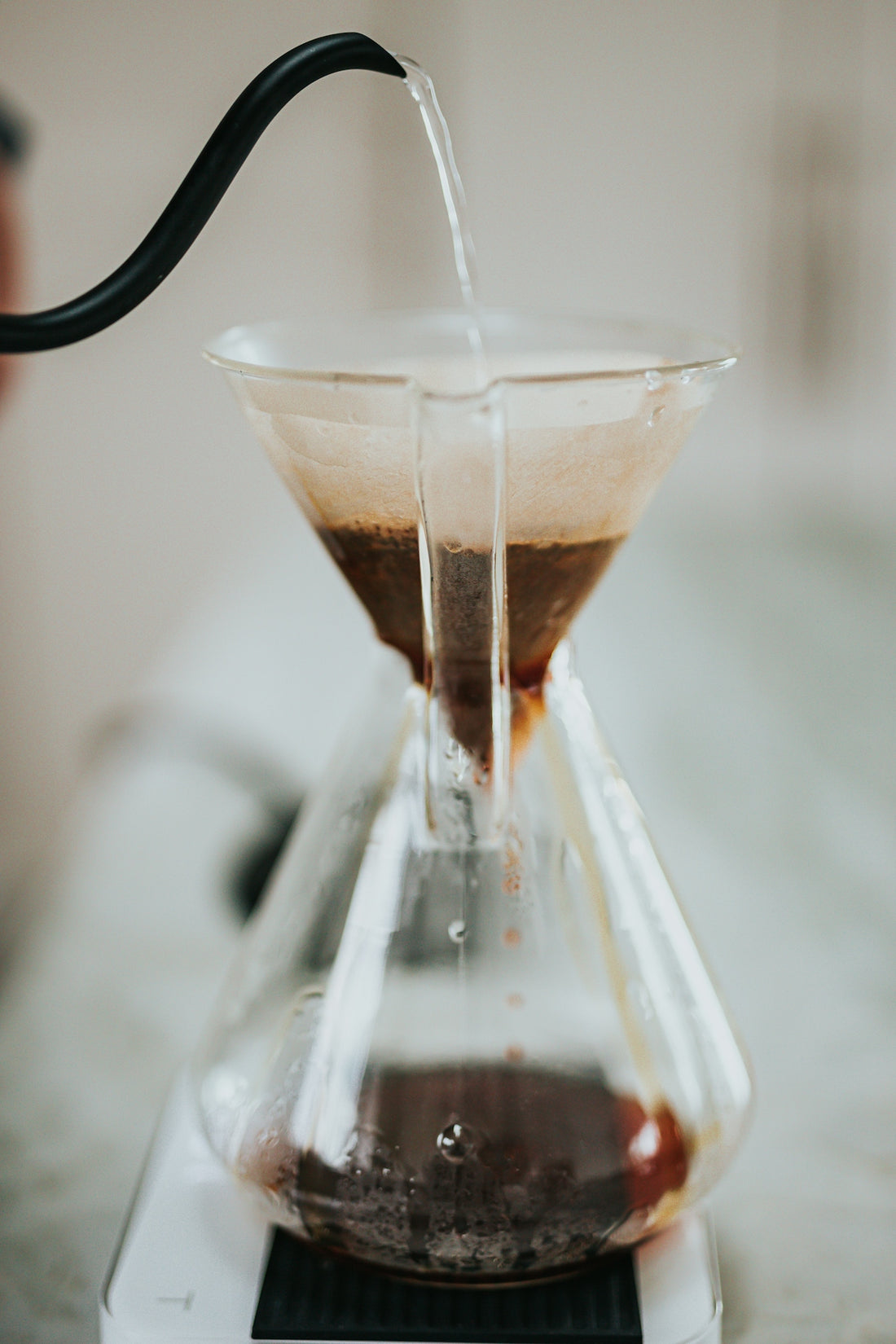 clear glass cup with brown liquid