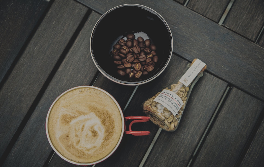 white and red ceramic mug with coffee