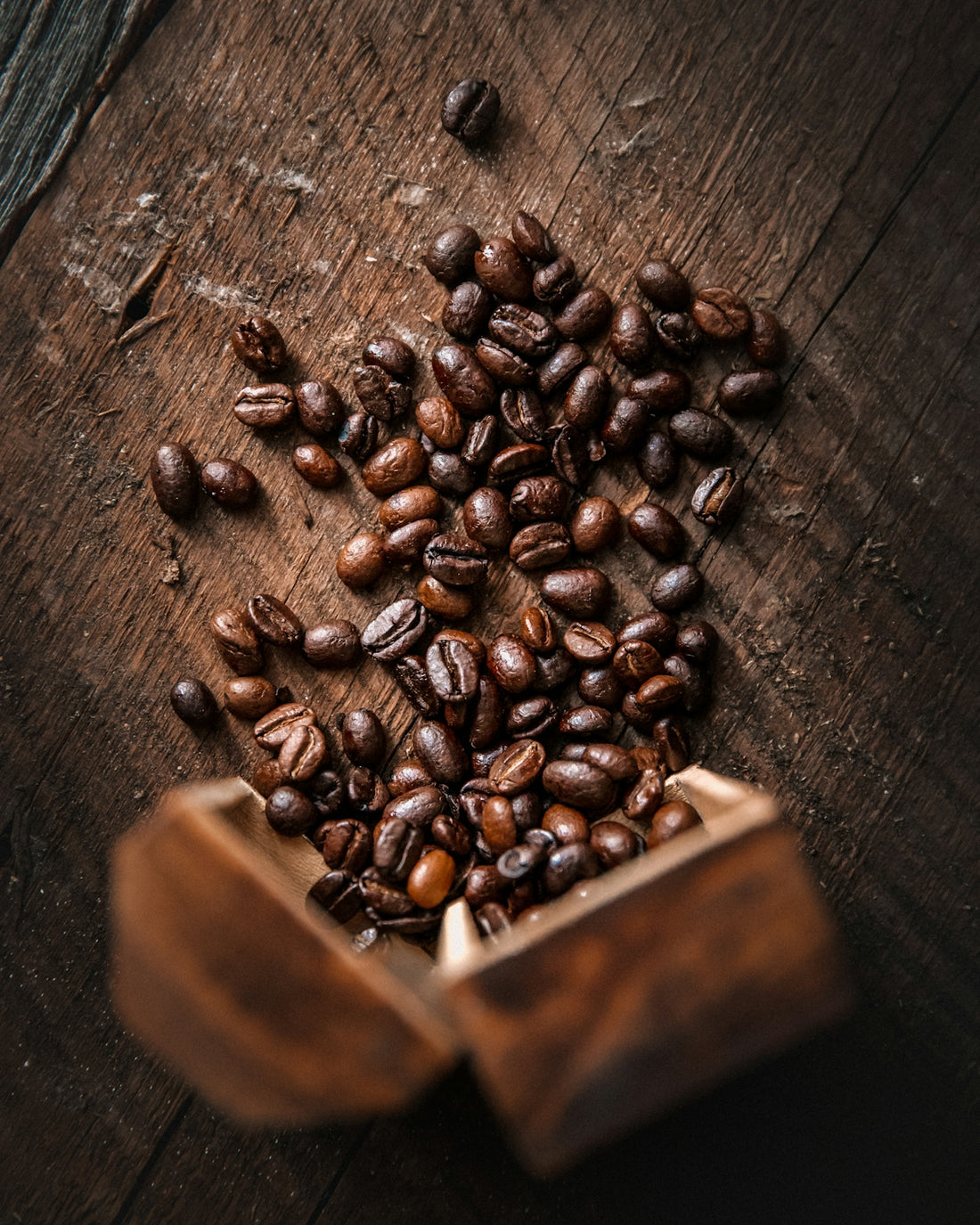 brown coffee beans on brown wooden table