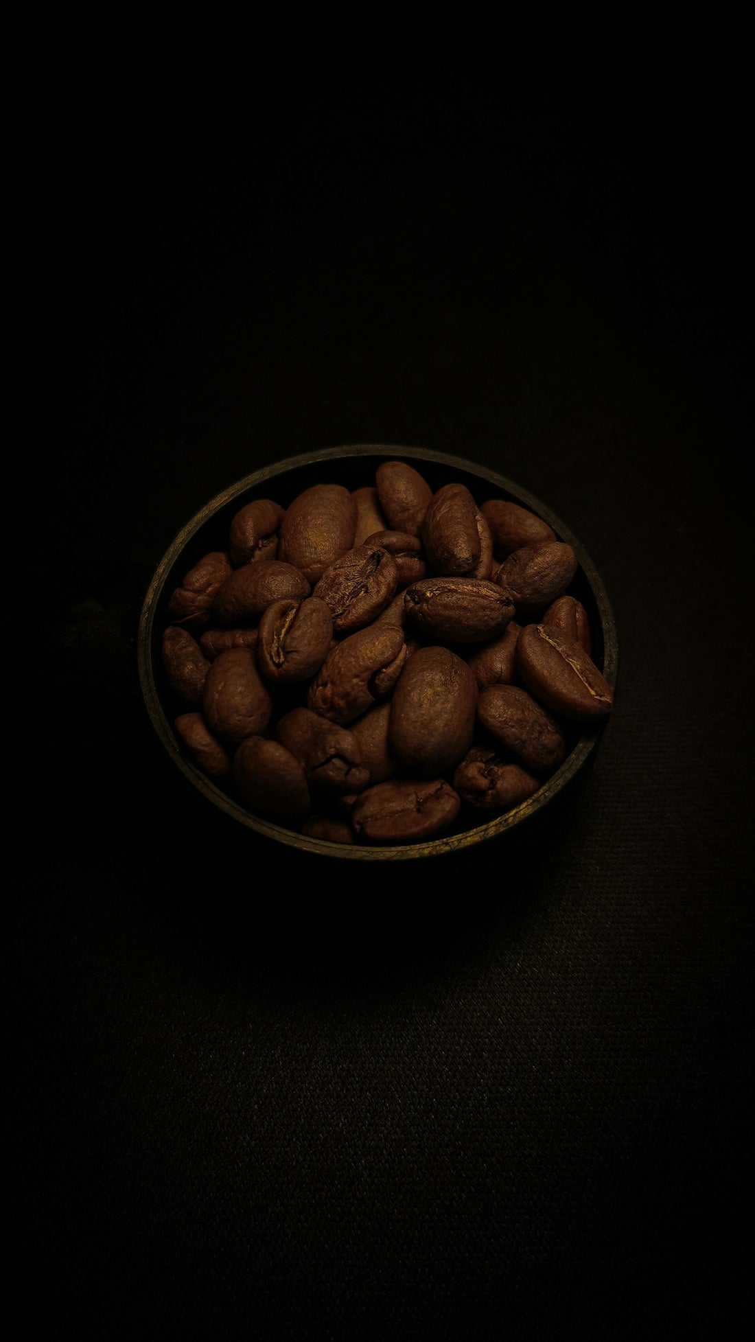 a bowl filled with nuts on top of a table