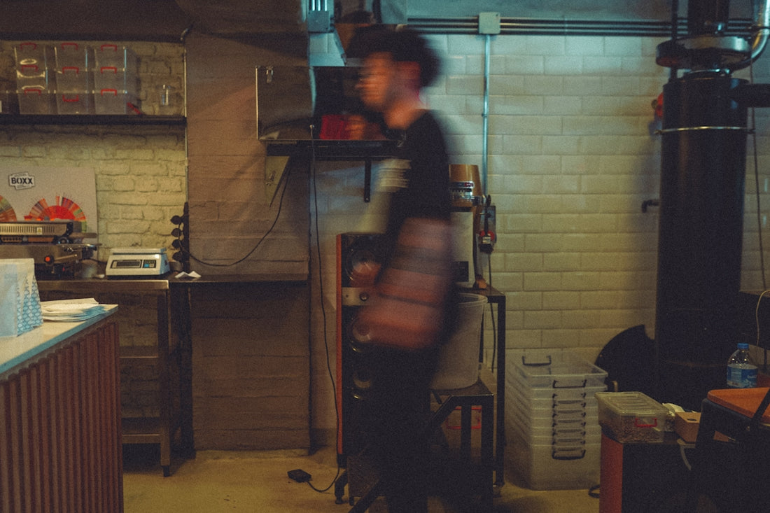 A blurry photo of a man in a kitchen